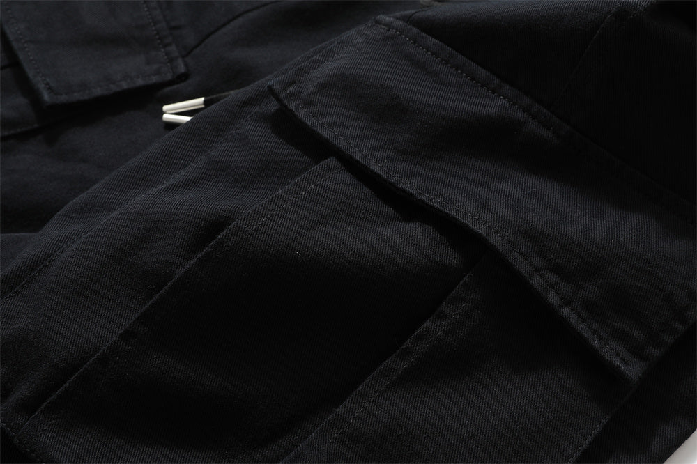 black cargo pants detail close-up pocket stitching utility fabric military style